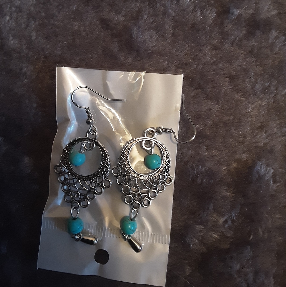 Silver tone/turquoise colored dangle earrings